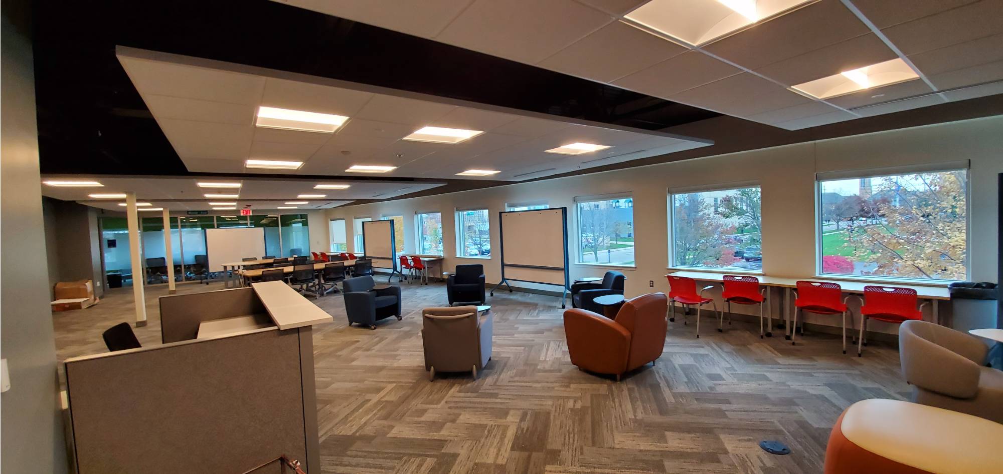 Open Collaboration Spaces with whiteboards and moveable chairs